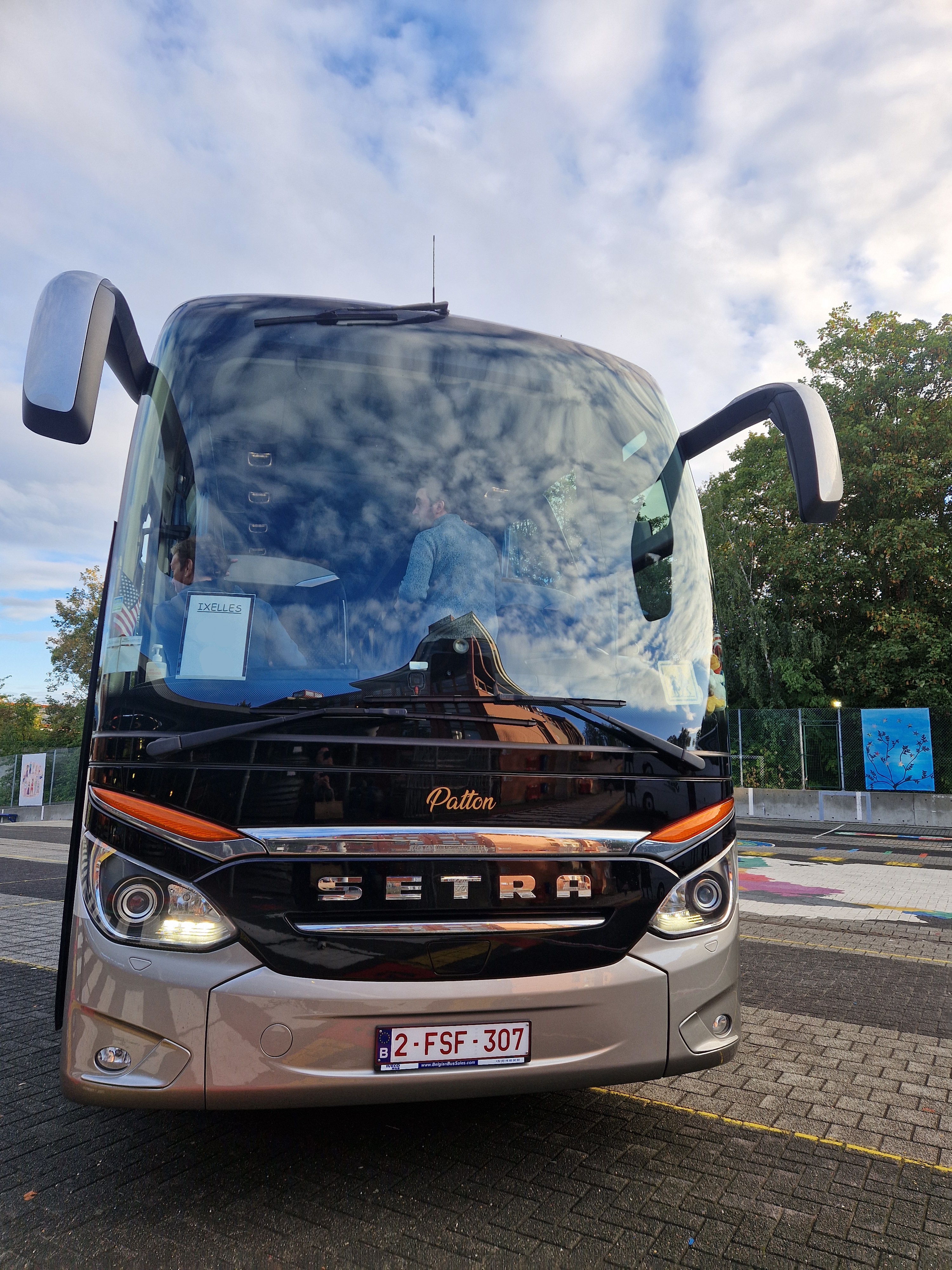 Exterior front of a Setra bus on the school parking lot 