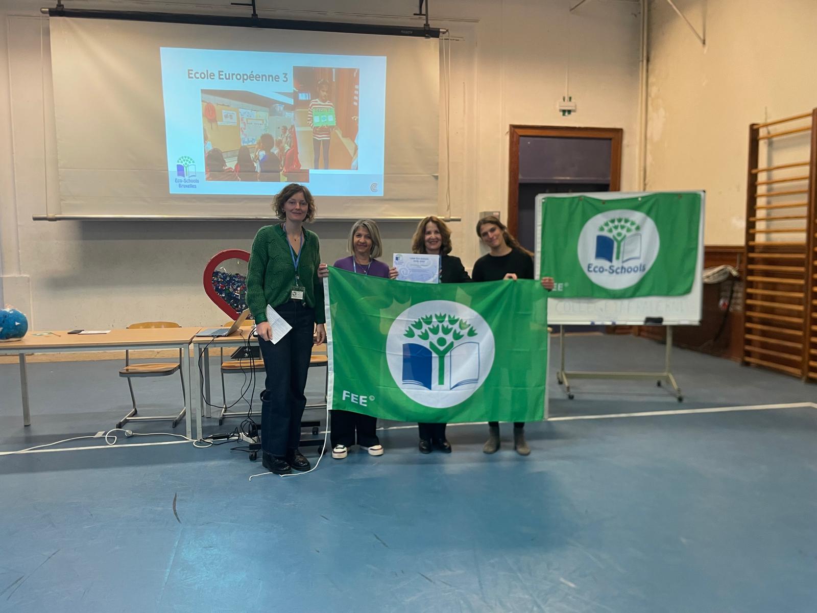 Photo of the EEB3 representatives to the Eco-School Awards 2025 presenting the flag